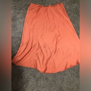 A new day long orange skirt.